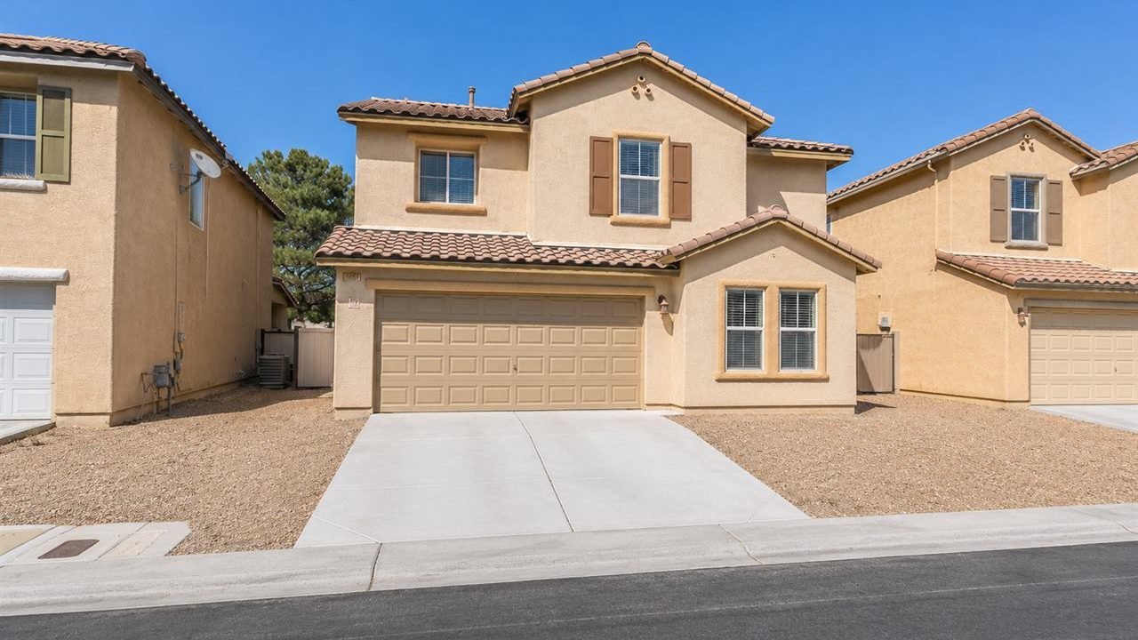 Two-story Fernwood rental home with shuttered windows in Las Vegas, Nevada